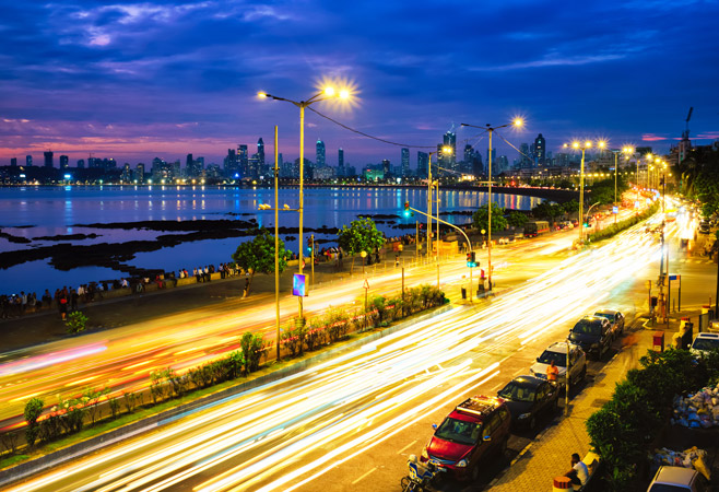 At night, Marine Drive transforms into the famous “Queen's Necklace” — a glowing curve of lights along the coast