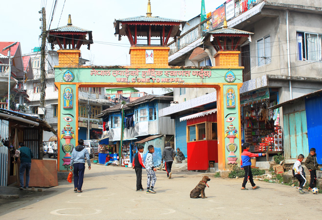 The open border between Nepal and India is due to an agreement of a bilateral Indo-Nepal treaty of peace and friendship signed in 1950