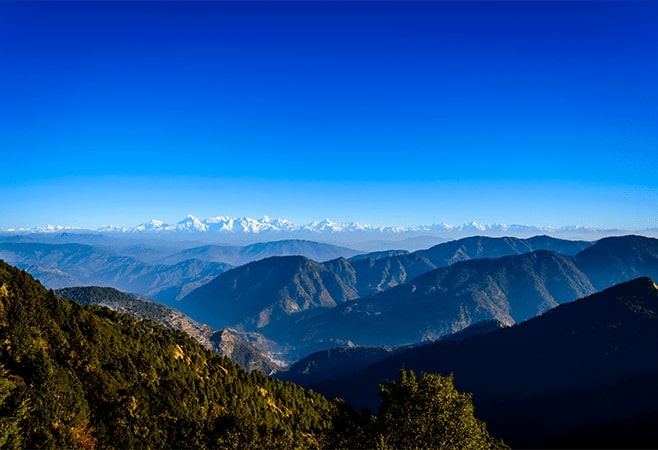Snow View Point, at 2270 meters,  offers panoramic views of Himalayan peaks from Mallital , with a small temple