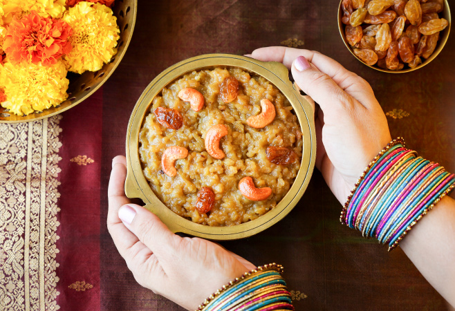 Sweet Pongal is a delicious South Indian festive dish made with rice, moong lentils, ghee, jaggery or sugar, cardamoms, and nuts