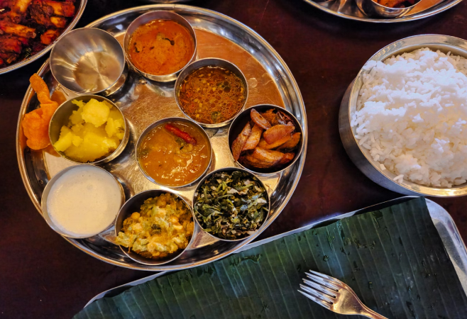 Experience the vibrant flavors of traditional Gujarati cuisine at Gordhan Thal
