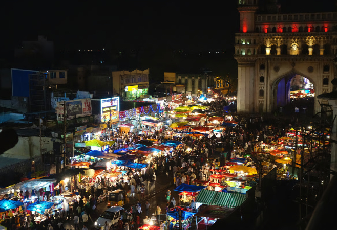 Night markets in Delhi brings bouts of delicious street food and some amazing clothing options all lit up under string lights