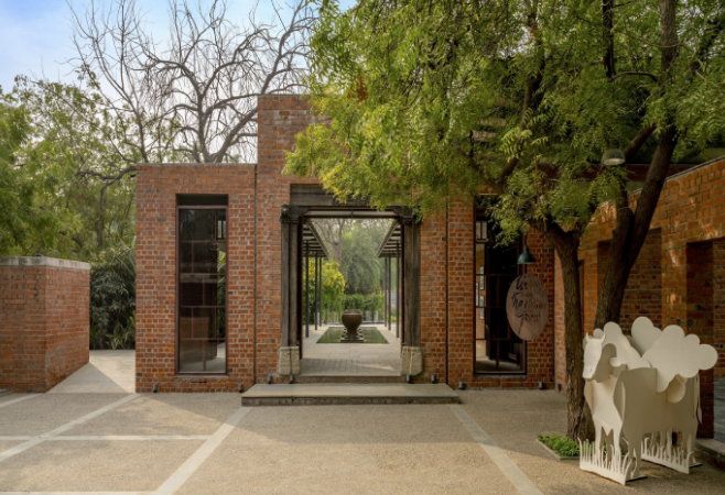 Set amidst lush greenery and open brick walls, the ambiance is rustic and charming